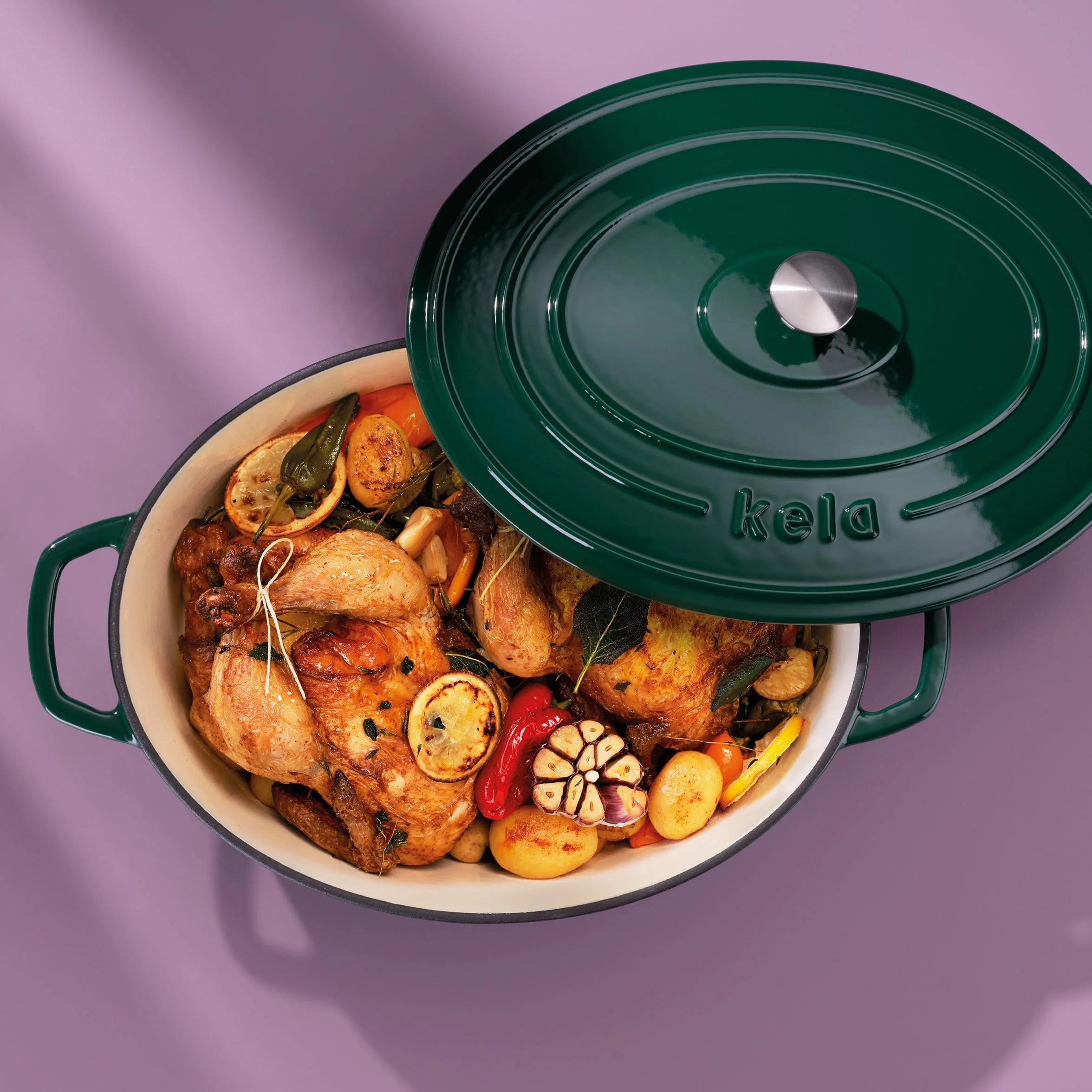 kela Casseruola ovale in ghisa 9,3 litri, forno olandese Calido, cottura a induzione con coperchio, pentola in ghisa per cuocere il pane, smaltato, verde